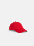 The Washed Canvas Baseball Cap, featuring a plain red design and a curved brim, is displayed against a white background.
