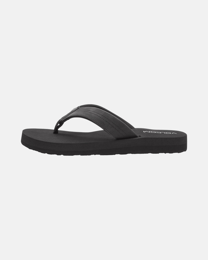 The Volcom Women's Boyfriends Thong is a plain black sandal with simple straps, a comfort foam footbed for support, and a flat sole, shown on a white background.