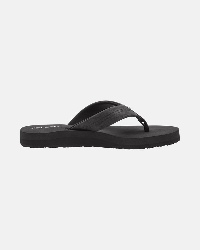 The Volcom Women's Boyfriends Thong is a black sandal flip-flop featuring a comfort foam footbed, textured sole, and simple thong strap, shown in side view against a plain white background.