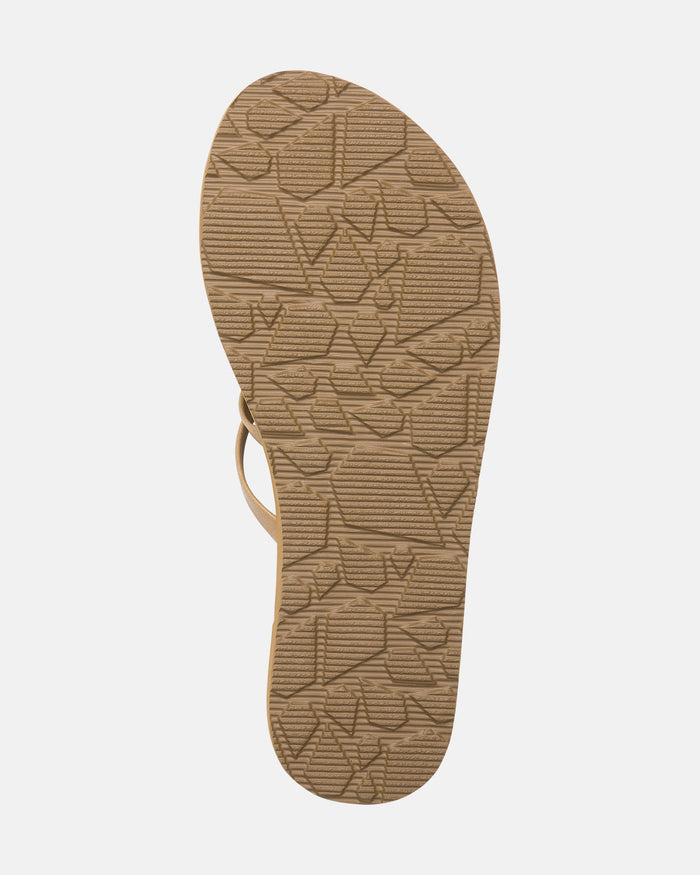 The Volcom Women's Easy Breezy II tan strappy sandal is shown from the bottom, highlighting its geometric textured rubber sole and supportive arch support, all set against a plain white background.