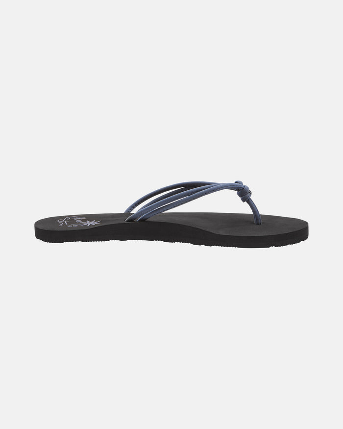The Volcom Women's Forever And Ever II flip-flop features thin dark blue straps with a small knot near the toes and a sleek black sole, displayed against a plain white background.