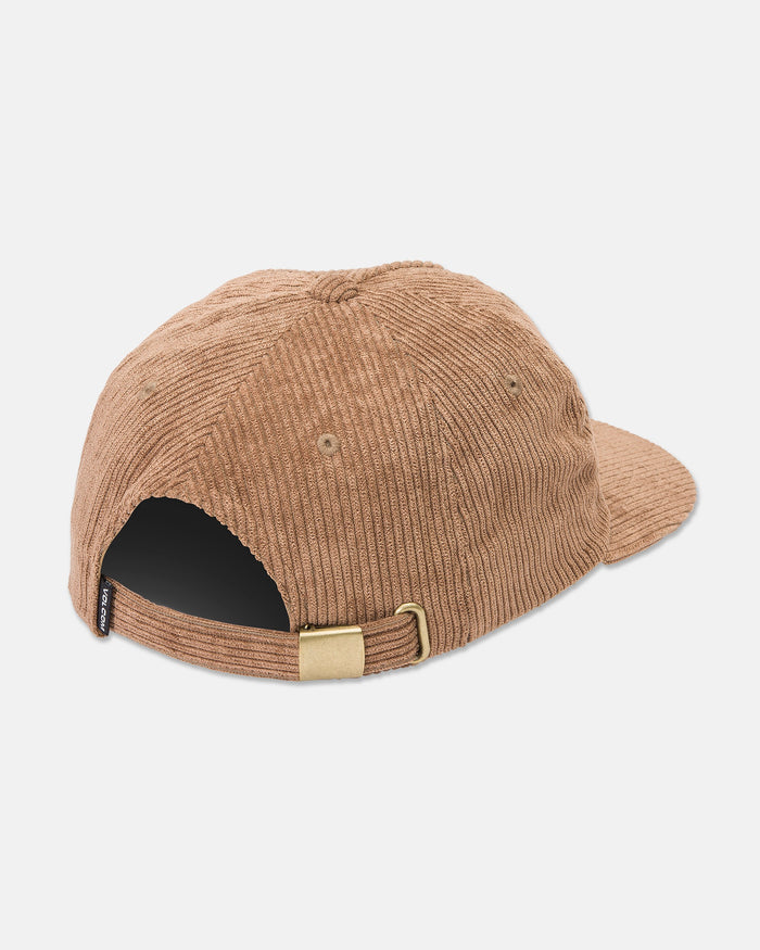 The Volcom Women's Full Stone Dad Hat is shown from the back in brown corduroy, with a curved brim, adjustable strap with brass buckle, left-side black tag, and visible stitching.