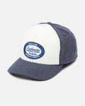 The Women's Mechanicali Hat by Volcom is a blue and white cotton twill cap featuring a curved brim, classic workwear style, and a front blue oval patch that reads "Volcom Authentic Durable Goods Quality Made.