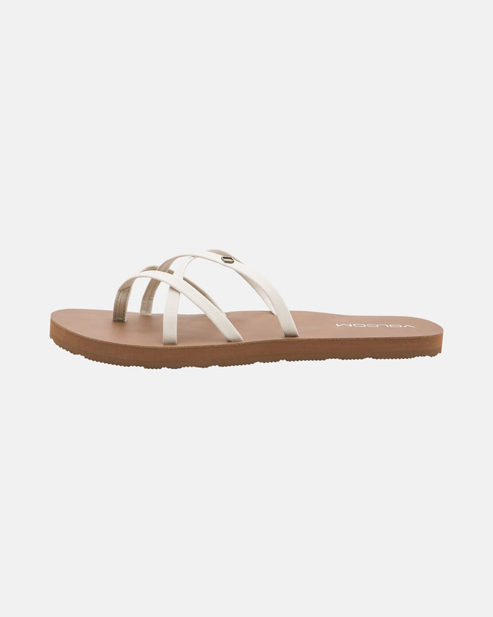 The Volcom Women's New School II sandal features a minimalist brown design with three thin white synthetic leather straps, an open toe, and offers comfortable all-day wear.