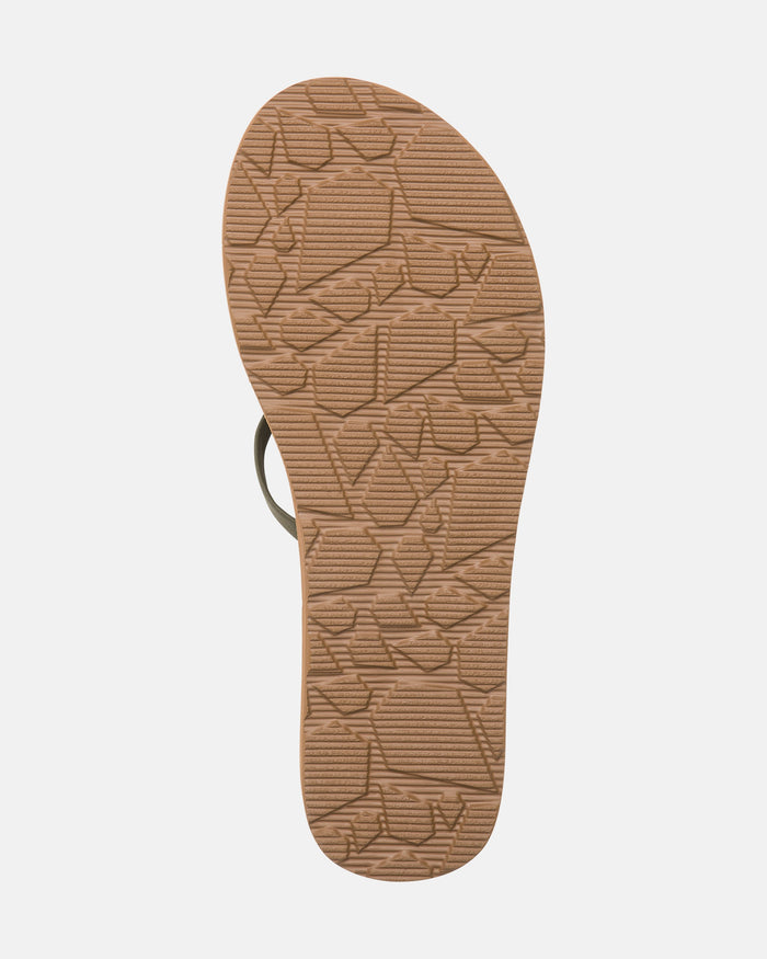 The image displays the sole of the Volcom Women's New School II flip-flop sandal in light brown with a textured geometric pattern and arch support, set against a plain white background.