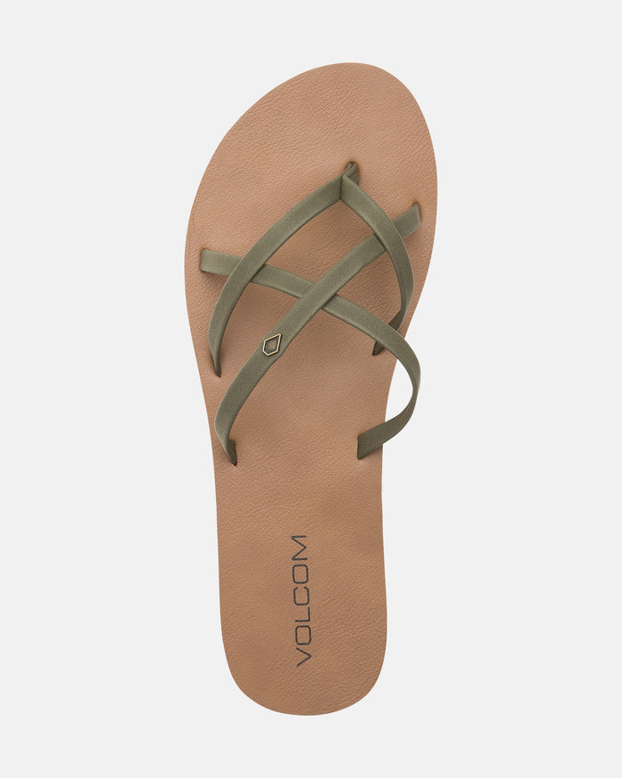 A single tan Volcom Women's New School II flip-flop, with olive green synthetic leather crisscross straps and Recliner Comfort Foam, is shown from above on a plain white background.
