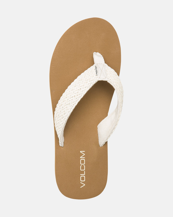 A single Women's Oasis Sandal by Volcom featuring a tan footbed and a white braided fabric strap with "Volcom" printed in white, displayed on a plain white background.