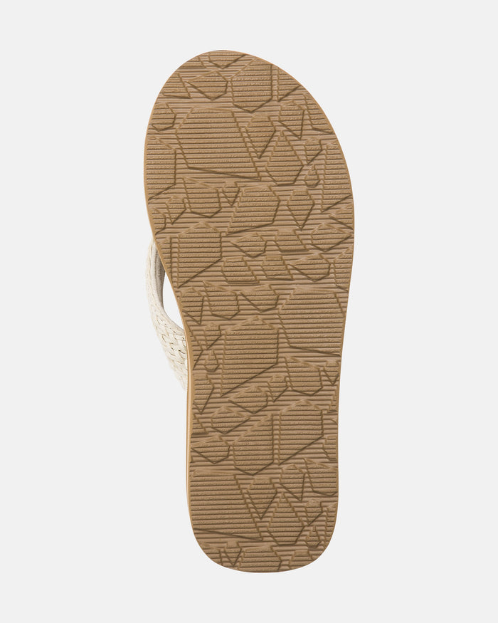 The image shows the bottom view of Volcom Women's Oasis Sandals in beige, featuring a textured rubber sole with a geometric pattern for added grip.