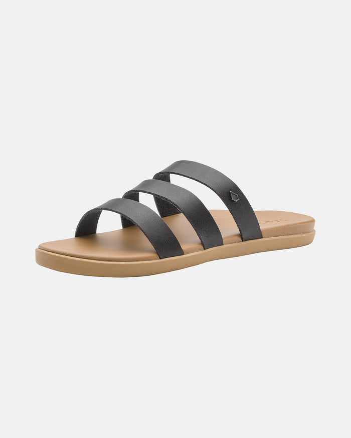 The Volcom Women's Sunseeker Sandals feature three black straps over a tan footbed and flat tan sole, shown against a plain white background.