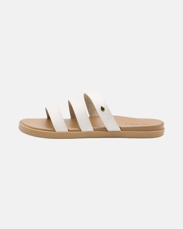 The Volcom Women's Sunseeker Sandals feature a tan sole with three white leather straps across the top, shown against a plain light background.