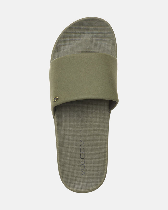 The Women's Volcation Slides by Volcom feature an olive green wide strap, a textured footbed, and the VOLCOM logo on the sole, providing everyday comfort and signature style in a single summer sandal.
