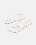 A pair of Volcom Volcomotion Womens white flip-flops with thin straps, featuring the black Volcom logo on the footbeds and straps, shown against a plain white background.