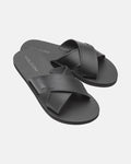 The Women's Volcomotion Strap Sandals by Volcom feature black crisscross straps and textured soles, with the brand name visible on the straps and footbeds, displayed against a plain white background.
