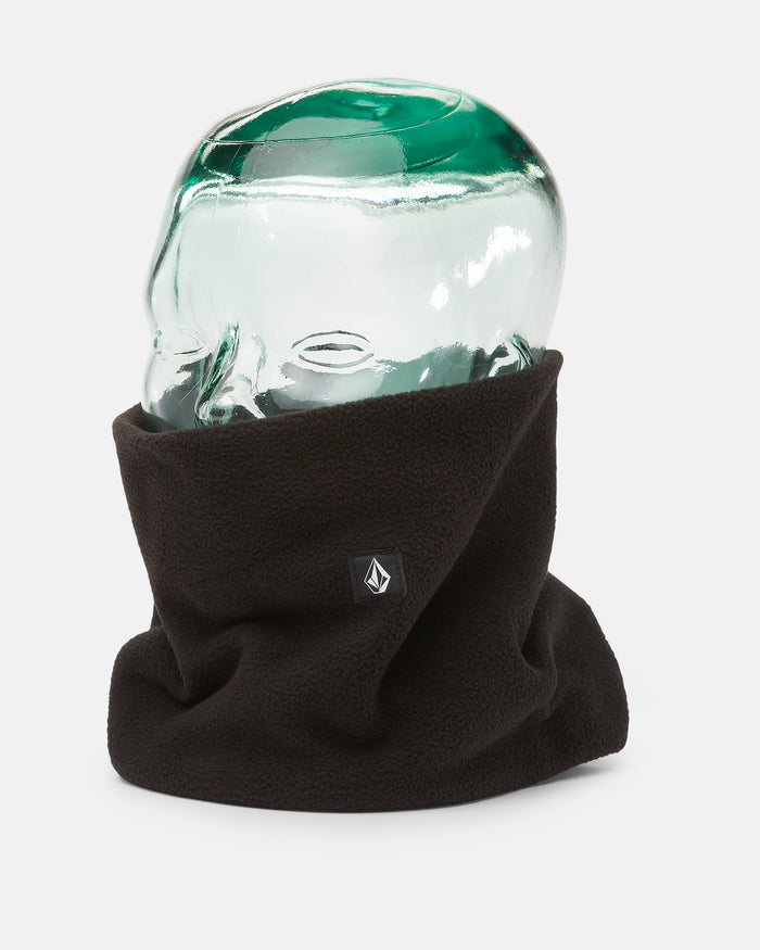 The Volcom Women’s V.Scout Neckband, a black polyester fleece neck warmer featuring a small logo and designed for exceptional warmth, is displayed on a transparent glass head model against a plain white background.